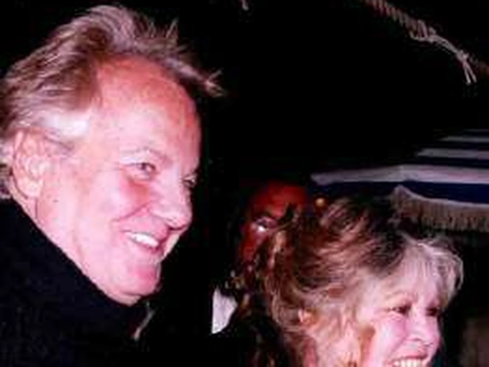 Massimo Gargia et Brigitte Bardot côte à côte lors d'une soirée, photographie d'archive